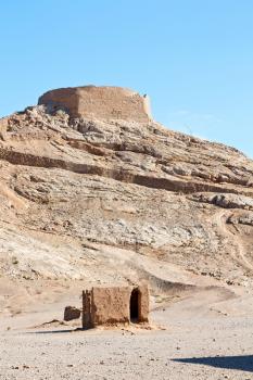 blur in iran near yazd the antique zoroastrian temple abandonated house and contruction