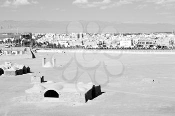 blur in iran near yazd the antique zoroastrian temple abandonated house and contruction