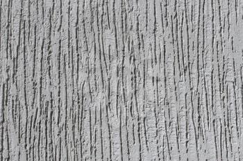 Detail of a bumpy plaster walls grey color close-up as a texture, horizontal
