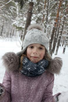 Girl walking in the winter forest and having fun with snow 30088