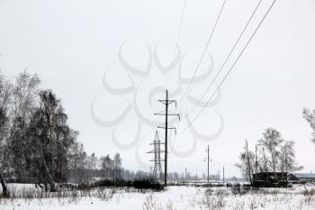 Power lines in winter woods 30102