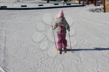 Young girl skiing on a ski track 30322