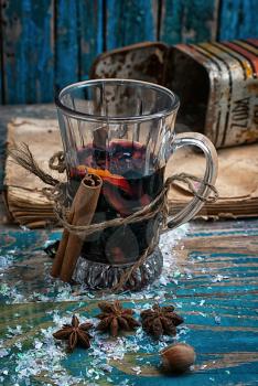 glass of mulled glass of mulled wine with spices in retro style wine 