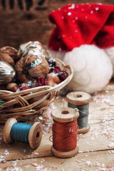 Christmas card with nuts,Christmas decorations and spools of thread