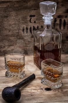 glass carafe with alcoholic drink of whiskey vintage style