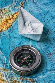 outdated compass sailor on a topographic map