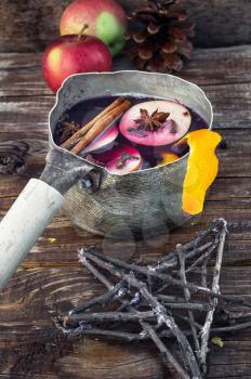 retro pot with mulled wine in the autumn still life