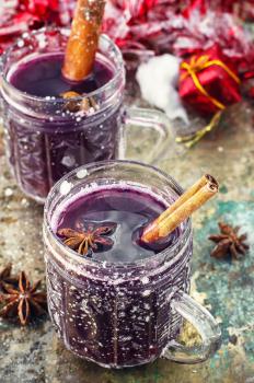 Crystal goblet with mulled wine and cinnamon stick in it