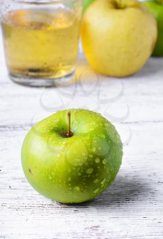 Fresh juice from the fruit green apple on a light background