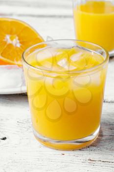 Glass cup with fresh orange juice vitamin