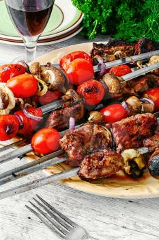 Beef fried on the coals,strung on skewers with vegetables