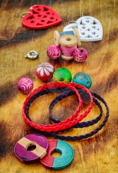 Elements for making jewelry from beads and leather straps