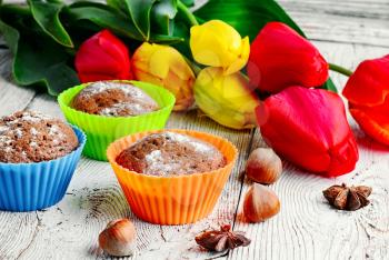 Sweet muffin tins and bouquet of fresh cut tulips