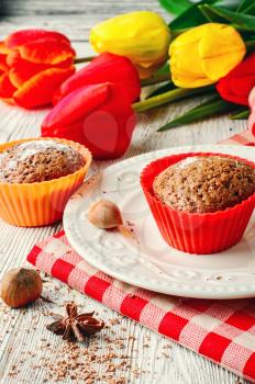 Sweet muffin tins and bouquet of fresh cut tulips