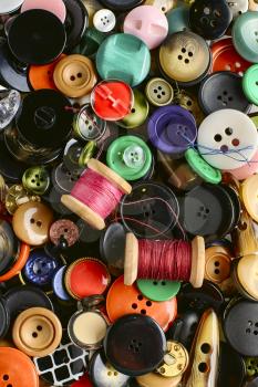 Set of various sewing buttons and thread.Top view