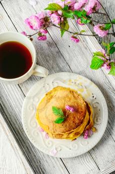 Morning breakfast with pumpkin pancakes and cup of coffee