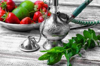 Small smoking hookah with strawberry,mint and lime