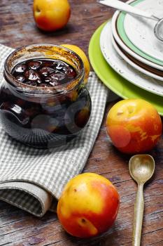 Glass jar with jam from the harvest of autumn plums