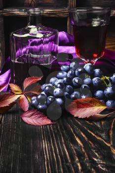 Young red wine in the glass from the autumn harvest of grapes.Copy space
