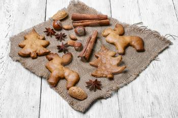 Cookies in the shape of Christmas tree and Christmas reindeer with spices