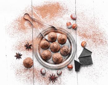 Chocolate truffles candies with cocoa powder and nuts