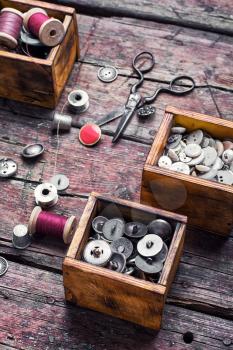 set of buttons from the clothing in wooden boxes in retro style
