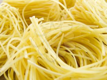 food background a pile of beautiful spaghetti nests
