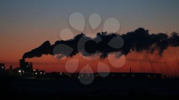 Black smoke silhouette on red sunset. Ecology industry environment factory pollution