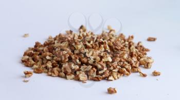Spill purified walnut on white background, Drupe pile heap