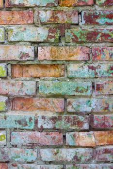 Grunge colored brick wall. Old vertical brickwork decor backdrop. Architecture texture design background
