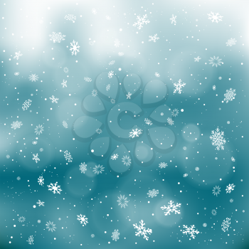 Closeup snowfall on dark sky backdrop. Winter holiday Christmas background. Big and small snowflakes falling from clouds