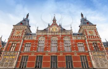 Facade of Amsterdam Centraal old building. Central railroad station of the City