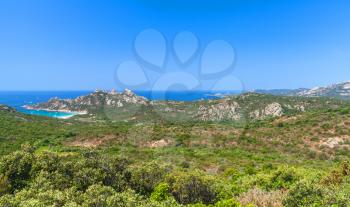 Corsica island, coastal landscape with mountains and beach. Mediterranean Sea coast, France