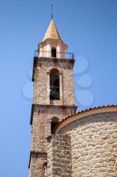 Catholic church exterior, bell tower fragment. Sartene, South Corsica, France