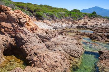 Coastal landscape with rocks and lagoon, Corsica island, France. Plage De Capo Di Feno