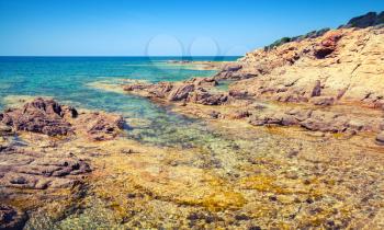 Coastal landscape with empty rocky wild beach, Corsica island, France. Plage De Capo Di Feno
