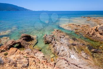 Coastal landscape with rocks and sea water, Corsica island, France. Plage De Capo Di Feno