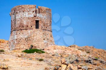 Old Genoese tower on Capo Rosso cliff, Corsica island, France