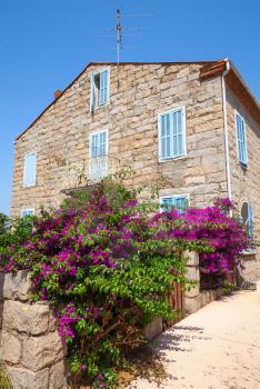 Old stone living house facade, Figari town, Corsica island, France