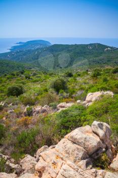 South Corsica, vertical coastal landscape with long cape going to the horizon over Mediterranean Sea water