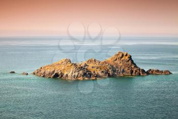 Small rocky island. Sanguinaires, Ajaccio, Corsica, France. Bright tonal correction photo filter effect