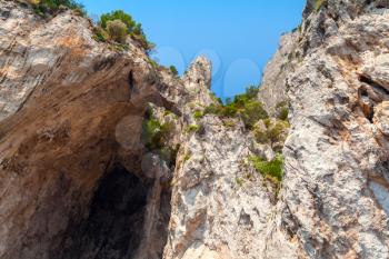 Coastal landscape with rocks and cave. Capri island, Mediterranean Sea coast, Italy