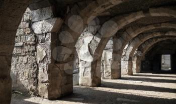Dark corridor interior with arcs. Ruins of Ancient city Smyrna. Izmir, Turkey