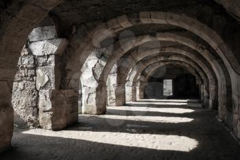 Interior of empty dark corridor with arcs. Ruins of Ancient city Smyrna. Izmir, Turkey