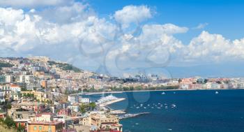 Gulf of Naples, cityscape under blue cloudy sky