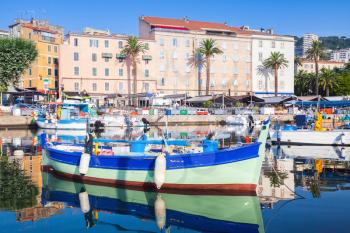 Small colorful wooden fishing boat moored in old port of Ajaccio, Corsica, France
