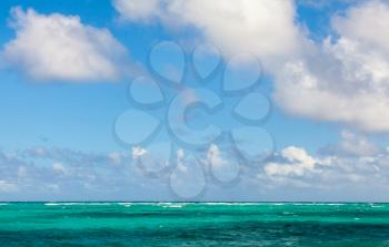 Bright empty sea landscape with cloudy sky. Atlantic ocean coast, Dominican republic. Punta Cana