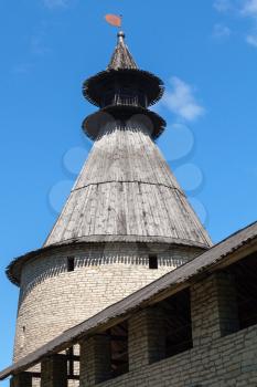Stone tower with wooden roofs of old fortress. Kremlin of Pskov, Russia. Classical Russian ancient architecture