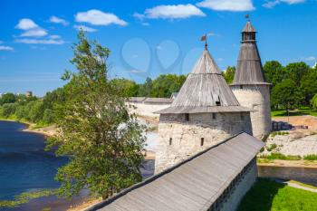 Stone towers and wall of old fortress. Kremlin of Pskov, Russia. Classical Russian ancient architecture