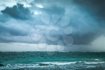 Stormy clouds over Atlantic ocean. Landscape with dramatic stormy sky, Dominican republic. Punta Cana. Blue toned photo with contrast filter effect